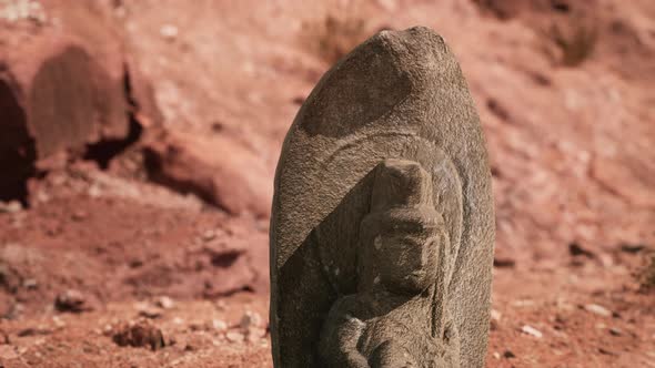 Ancient Statue on the Rocks Desert