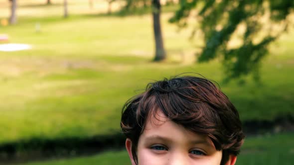 Portrait of smiling boy in park