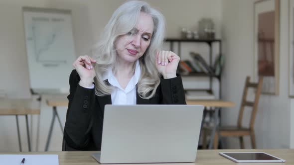 Middle Aged Businesswoman Reacting To Loss