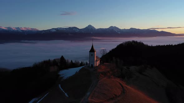 Church of St. Primoz and Felicijan at Sunrise. Julian Alps. Jamnik, Slovenia.