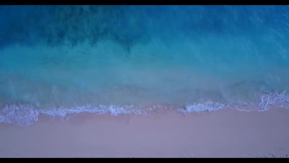 Aerial drone view panorama of luxury tourist beach trip by clear water and clean sand background of 