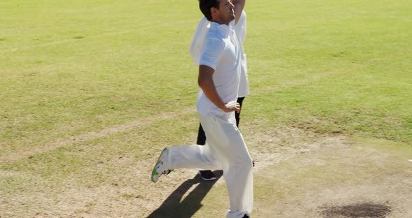 Bowler delivering ball during cricket match