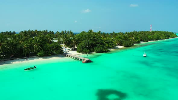 Beautiful overhead travel shot of a white sandy paradise beach and aqua blue ocean background in bes