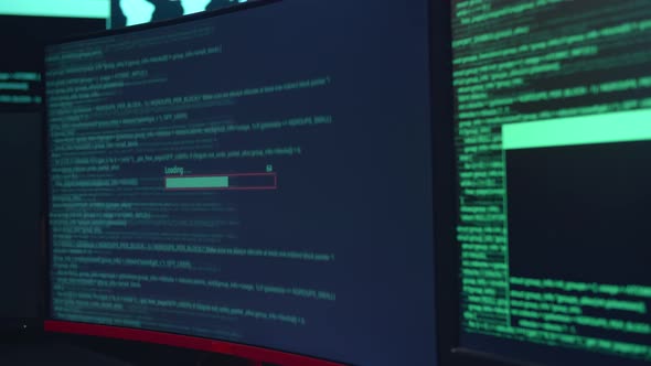Code On Multiple Computer Screens And Downloading Data, Cyber Attack