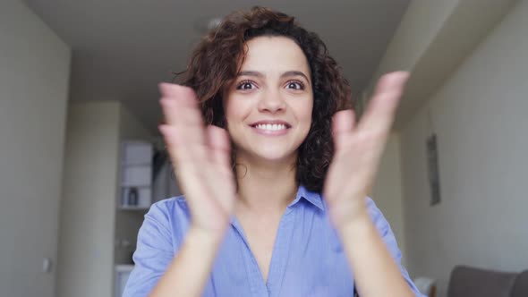 Closeup Portrait of Beautiful Smiling Young Woman Looking at Camera at Home