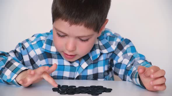 A 4Yearold Boy is Learning to Count Teaching Black Numeracy Chips for Preschoolers