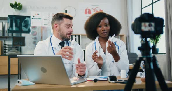 Male and Female Medics Recording Videovlog for Medical Channel