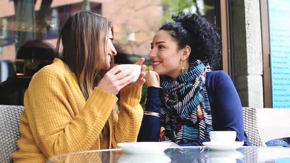 Lesbian couple having a coffee together