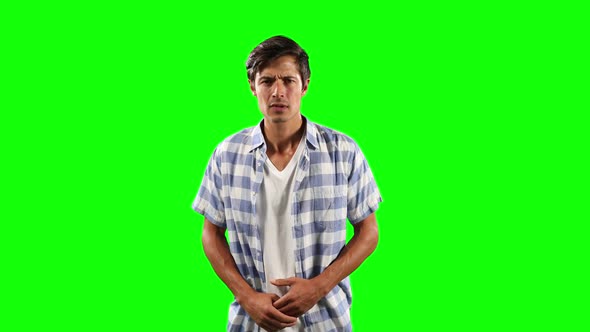 Front view of Caucasian worried man with green screen