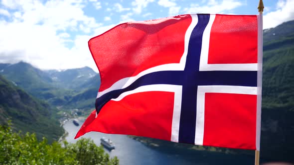 Norwegian Flag And Cruise Ship On Fjord