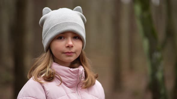 Portrait of a Happy Girl in the Woods