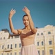 Graceful Ballerina Raises Hands Making Dance Moves in City - VideoHive Item for Sale