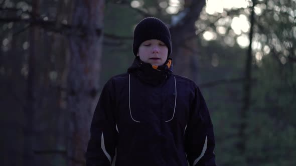 Portrait of Teenager in a Winter Pine Forest