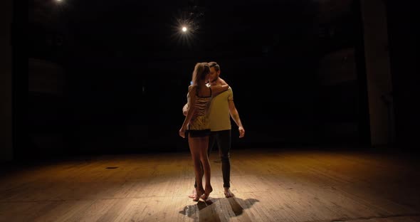 The Guy And The Girl Are Dancing On Stage