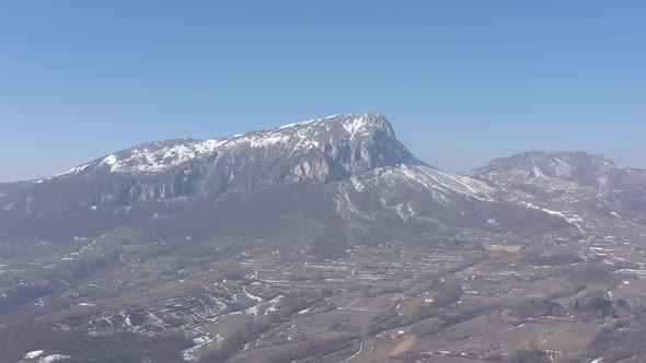 Clear blue sky over the top of Stol mountain 4K drone video