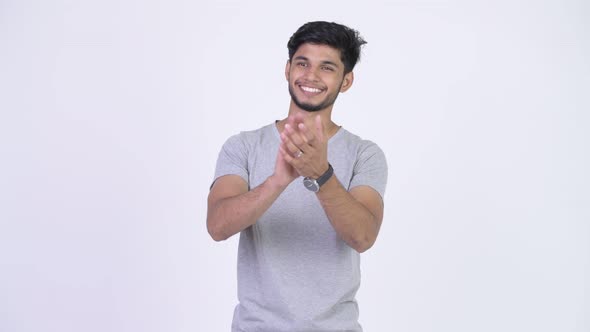 Young Happy Bearded Indian Man Clapping Hands