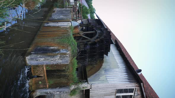 Old wooden water mill. Vertical video