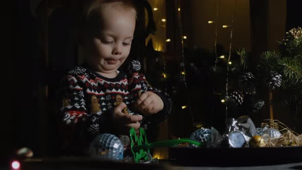 Toddler Boy Unpacking Christmas Present