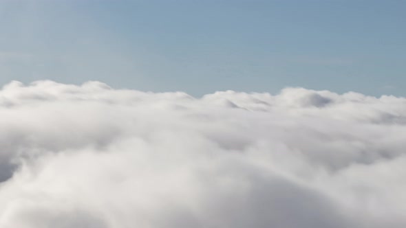 Aerial Timlapse of White Puff Clouds During a Sunny Day