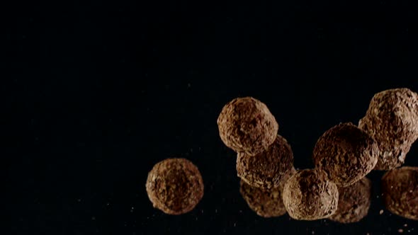 Flying and Falling Luxury Delicious Truffle Balls Golden Dust Decorated Slow Mo