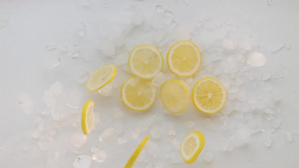 Lemon Slices with Ice Jump and Fall for Summer Lemonade Tonic and Soda Juice