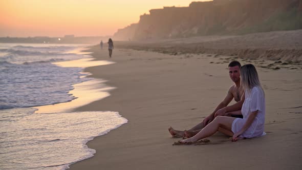 Newlyweds Young Couple on Valentine's Day on a Romantic Meeting By the Sea at Sunset