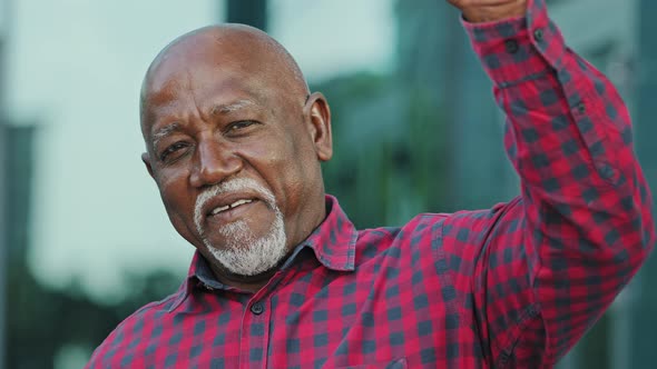 Portrait of Positive Elderly African American Man with Gray Beard Look at Camera Make Video Call