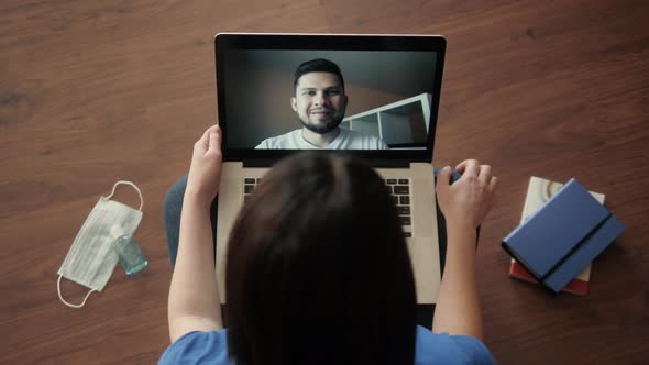 Young Woman Smiling While Videoconferencing at Home During Coronavirus Self Quarantine