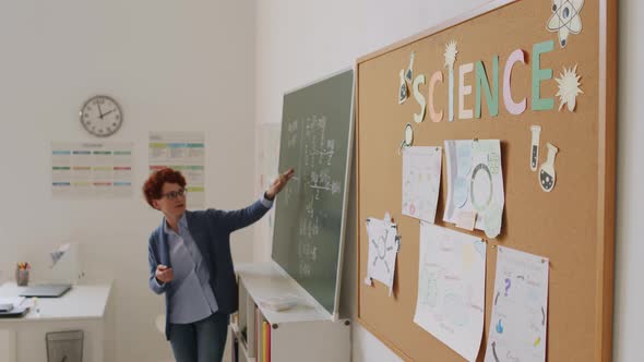 Female Science Teacher Giving Lesson
