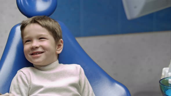 Little Boy Having His Teeth Examined By a Dentist