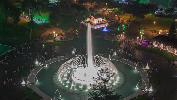 Aerial View to Park of the Reserve with Colorful Magic Water Circuit Biggest Fountain Complex Night