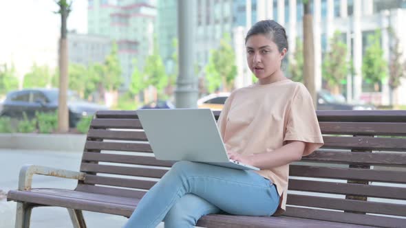 Rejecting Indian Woman in Denial While Using Laptop in Office