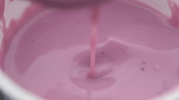 Close Up of Blue Blue Berry Yogurt in a Container