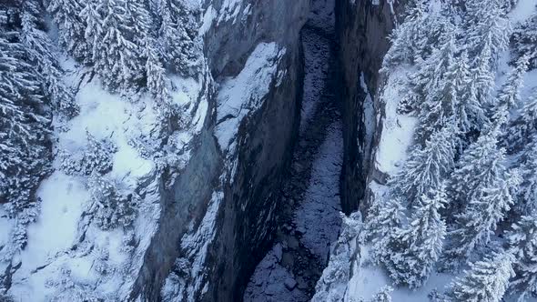 aerial view of a frozen river in a gorge in winter in the alps, Grindelwald, Switzerland