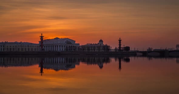 Timelapse of Old Stock Exchange Building and Rostral Columns in Dusk Water Area of Neva River at