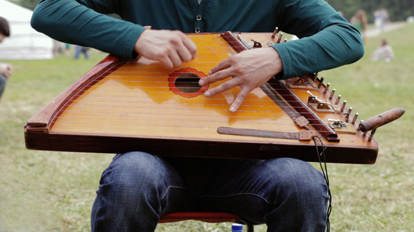 Folk Musician Playing Gusli