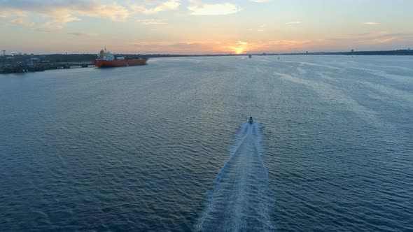 Motorboat Travelling In Front of Southampton Docks