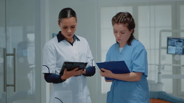 Orthodontists Working Team Discussing Dental Operation