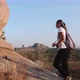 Young woman tourist with backpack walking at trail In mountains - VideoHive Item for Sale