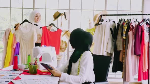 Muslim women fashion designers are in process of creating new clothes collection.