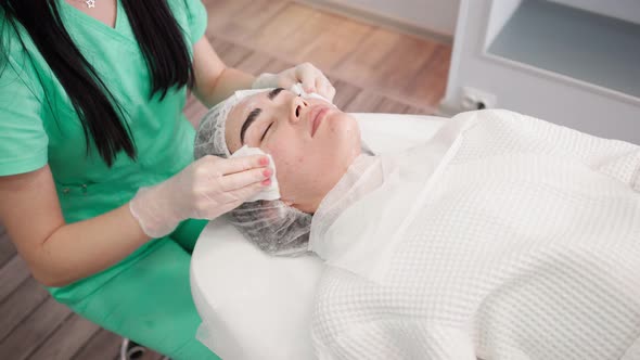 Woman Beautician Makes Procedures Facial Cleans Patient