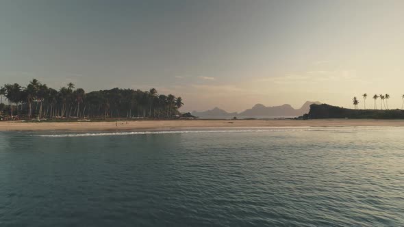 Timelapse of Seascape at Sand Beach with Palm Trees at Sea Shore Aerial