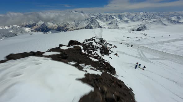 Shooting From Fpv Drone Active People Climbing on Elbrus Peak Going on Snowy Route