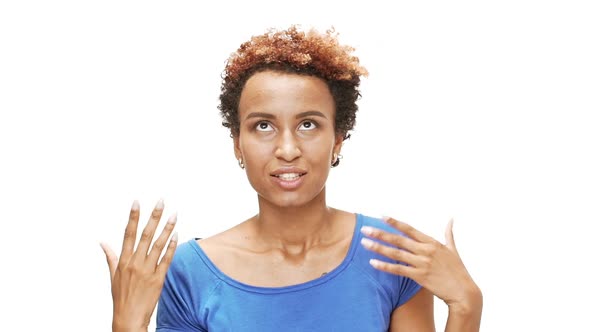 Young Beautiful African Girl Speaking Smiling Over White Background