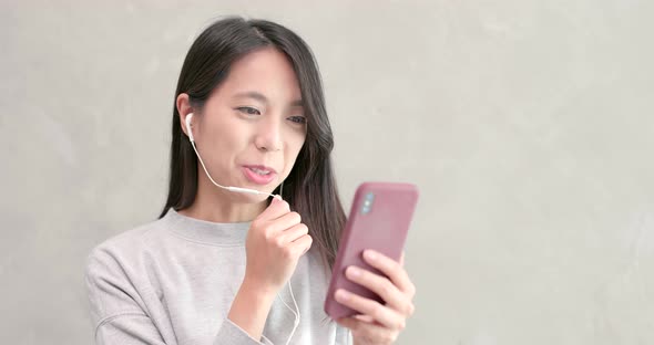 Woman talking on hand free with mobile phone 