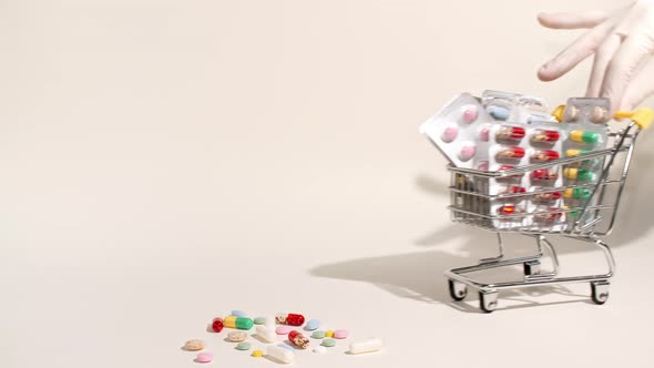 Closeup of Different Medical Pills in the Basket on Beige Background