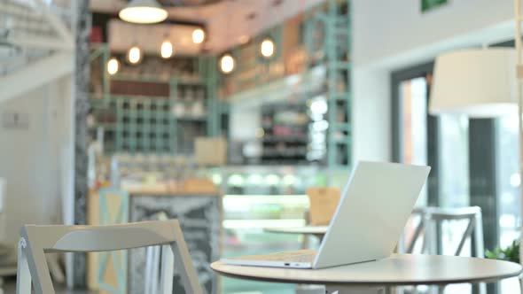 Women Coming and Sitting in Cafe Table with Laptop 