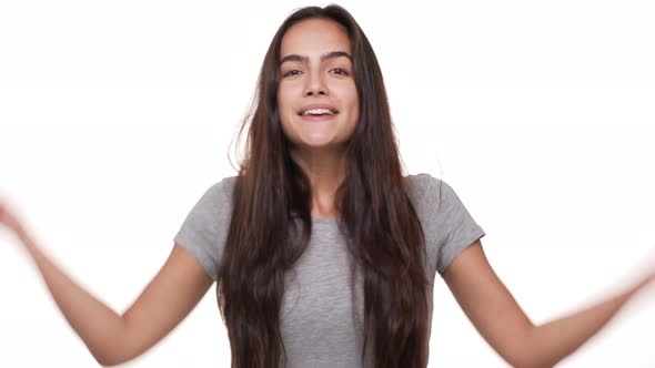 Portrait of Happy Caucasian Longhaired Woman Expressing Delight Excitement Clenching Fists Like