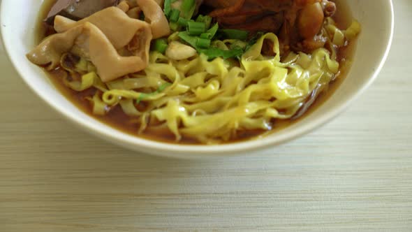 egg noodles with stewed and braised duck in brown soup - Asian food style