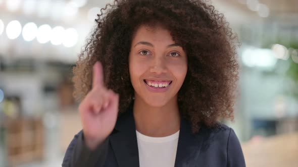 Young African Businesswoman Pointing at the Camera